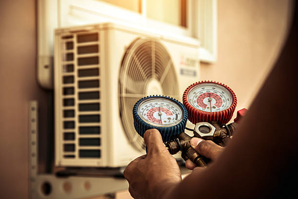 Professional Air Conditioning Service technician working in White Cottage, OH